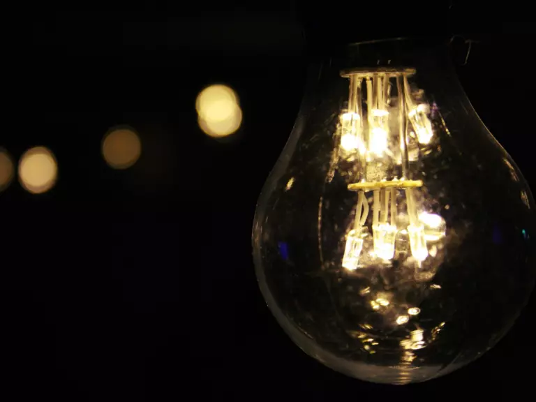 This modern LED lightbulb consumes 1/10th the energy of old-school incandescent bulbs.