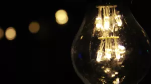 This modern LED lightbulb consumes 1/10th the energy of old-school incandescent bulbs.